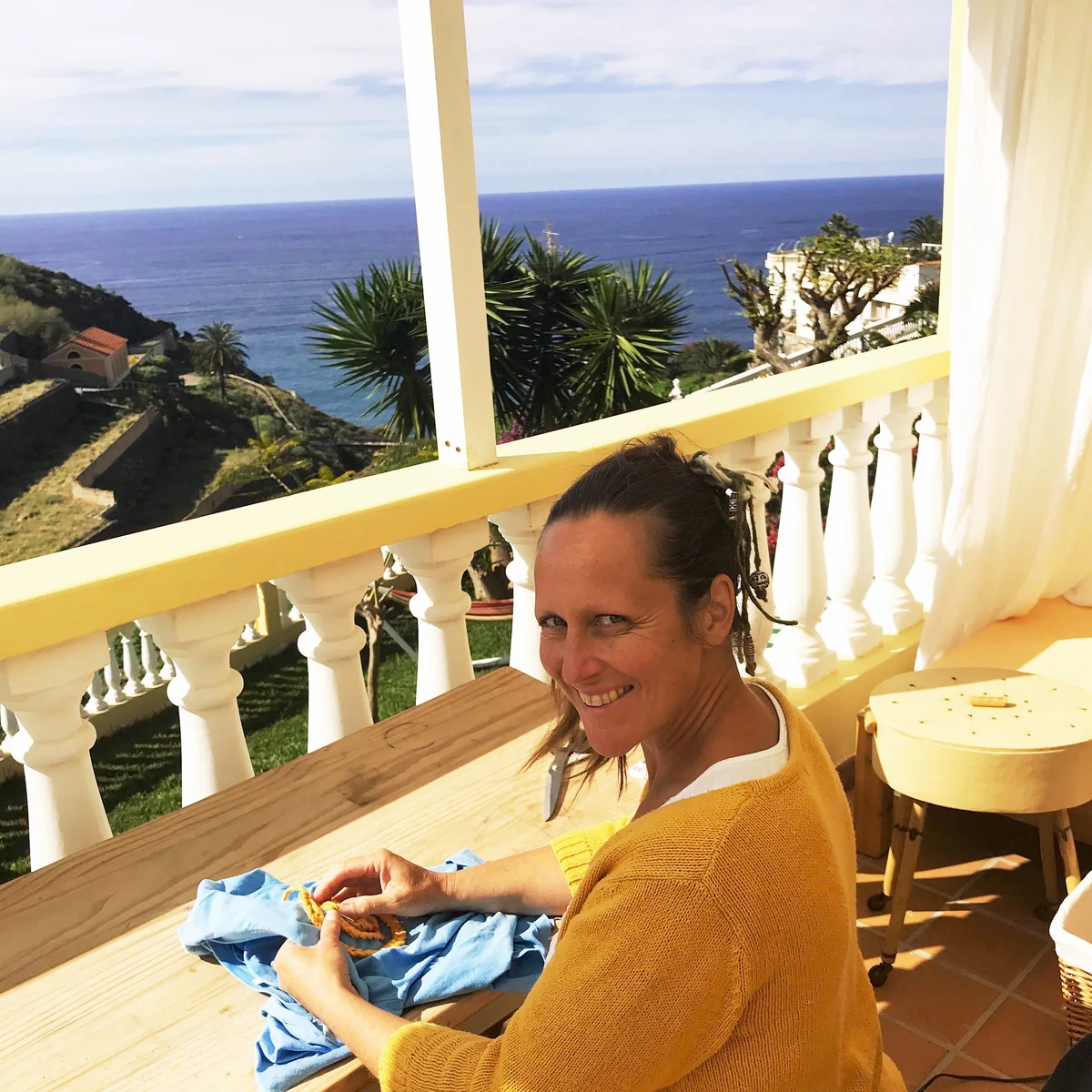 Sanni handcrafting beside an ocean view in Tenerife