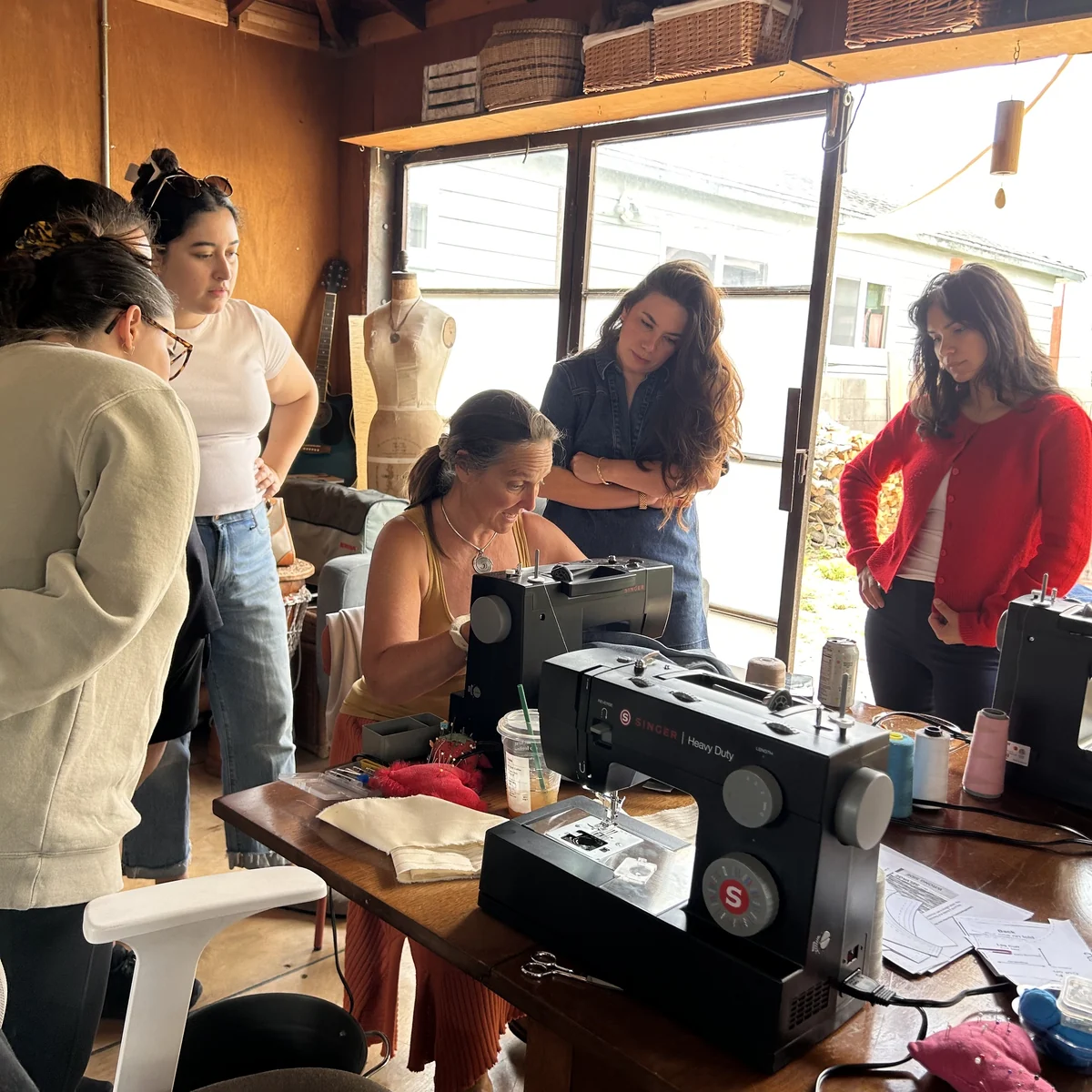 Friends learning to sew together in Sanni’s atelier